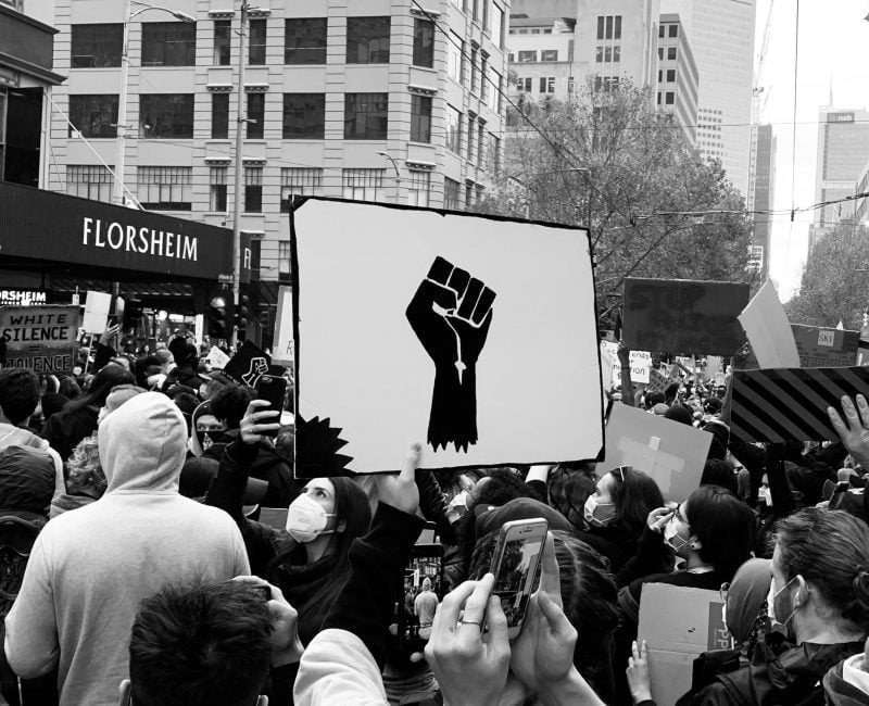 Sign at a Black Lives Matter rally in 2021 with power fist
