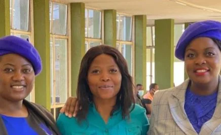 Joanah Mamombe, Cecilia Chimbiri, and Netsai Marova standing side by side