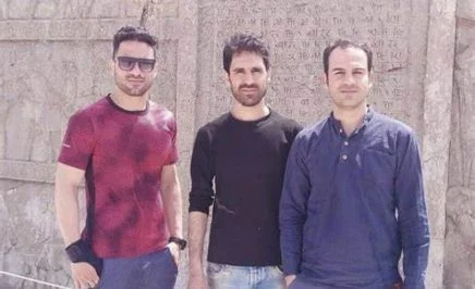 Brothers Vahid, Habib and Navid standing side by side