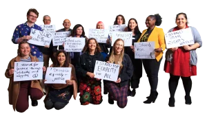 Amnesty staff holding placards stating what they stand for